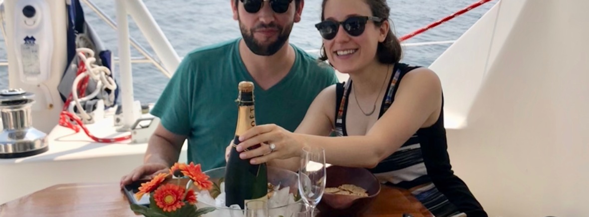 Engagement champagne on catamaran